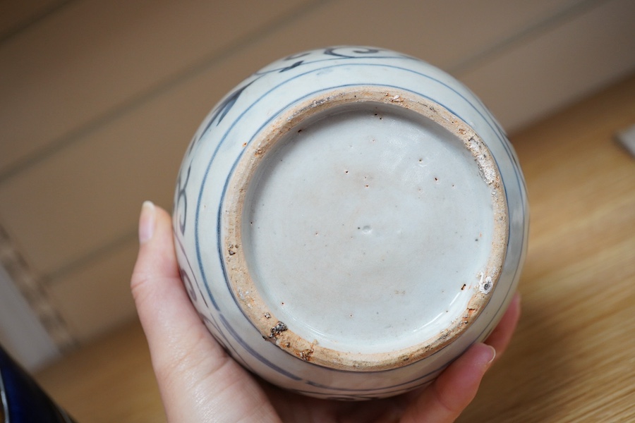 A Chinese blue and white Lion-dog jar and cover, late Ming dynasty, 17cm. Condition - poor